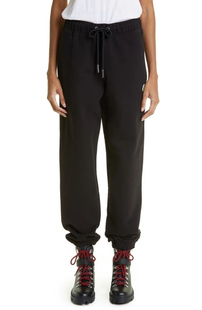 Moncler Logo Cotton Fleece Joggers In Black