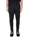 Moschino Jogging Pants With Adjustable Drawstring And Zippered Pockets In Black