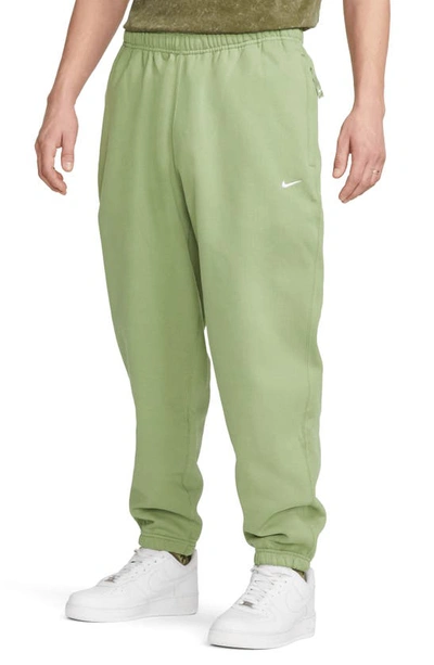 Nike Solo Swoosh Woven Track Pants Green In Oil Green/white