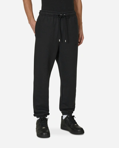 Nike Wordmark Fleece Pants In Black