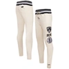 PRO STANDARD PRO STANDARD CREAM BROOKLYN NETS RETRO CLASSIC FLEECE SWEATPANTS