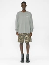 Frame Faded Washed Long Sleeve Graphic Tee In Old Green