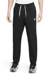 Nike Club Men's Woven Tapered Leg Pants In Black,white