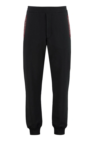 Alexander Mcqueen Tapered Logo Cotton Joggers In Black