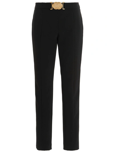 Moschino Smiley Buckle Trousers In Black