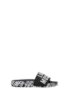 LOVE MOSCHINO SLIPPERS AND CLOGS PVC BLACK WHITE