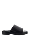 Ferragamo Logo Embossed Leather Slides In Nero