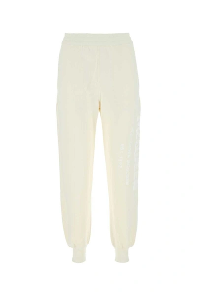 Alexander Mcqueen Logo Printed Track Pants In White