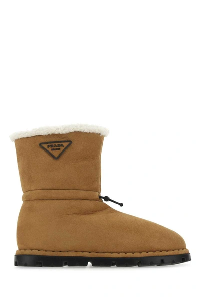 Prada Logo Patched Shearling Boots In Camel
