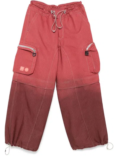 66 North X Charlie Constantinou Dyed Reflective Trousers In Red