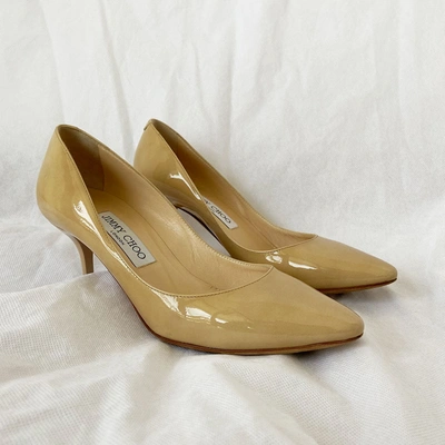 Pre-owned Jimmy Choo Beige Patent Leather Round Toe Pumps, 37.5 In Used / 37.5 / Beige