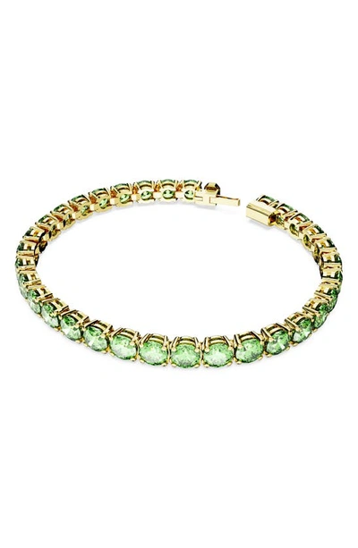 Swarovski Matrix Green Crystal Tennis Bracelet In Gold Tone In Emerald
