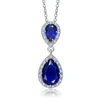 Genevive Sterling Silver With Rhodium Plated Two Sapphire Blue Pear With Round Cubic Zirconia Halo D In Silver