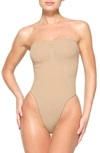 Skims Beige Seamless Sculpt Deep Plunge Thong Bodysuit In Clay
