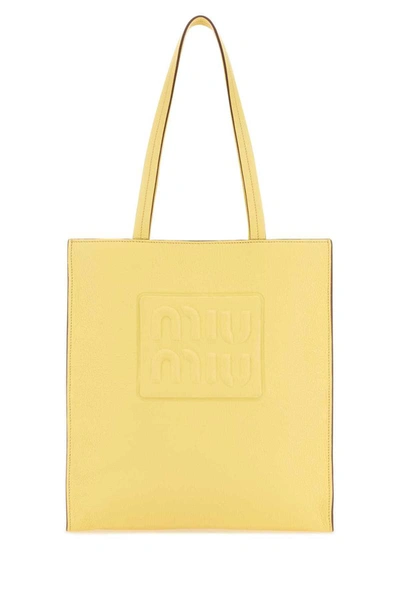 Miu Miu Handbags. In Yellow
