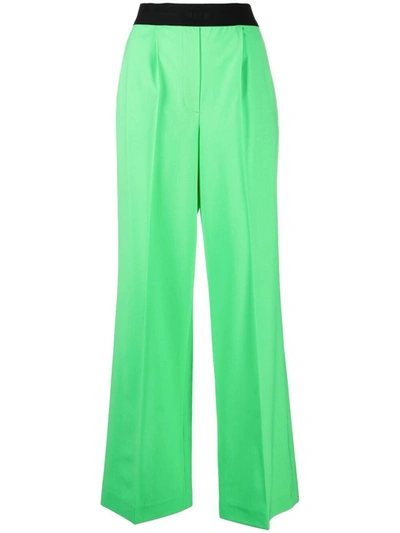 Msgm Logo Waistband Tapered Trousers In Green