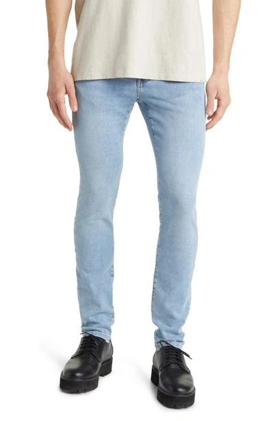 Frame L'homme Skinny-fit Distressed Denim Jeans In Light Denim