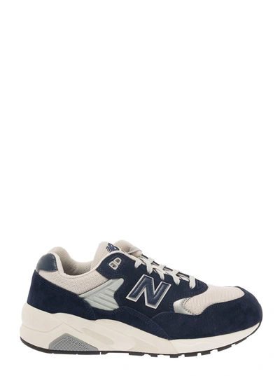NEW BALANCE BLUE AND WHITE LOW-TOP SNEAKERS WITH SUEDE INSERTS AND LOGO PATCH IN LEATHER MAN
