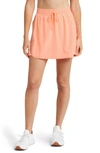 Beyond Yoga In Stride Lined Skort In Electric Peach