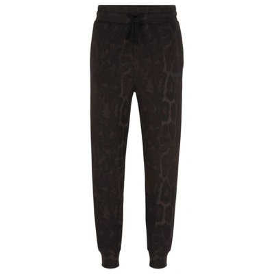 Hugo Men's Jaglion-pattern Tracksuit Bottoms In French-terry Cotton In Black