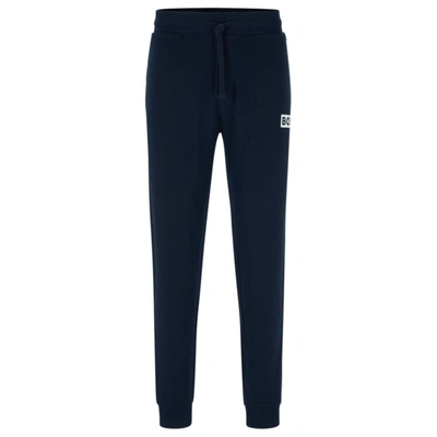 Hugo Boss Cuffed Tracksuit Bottoms In French Terry With Logo Print In Dark Blue