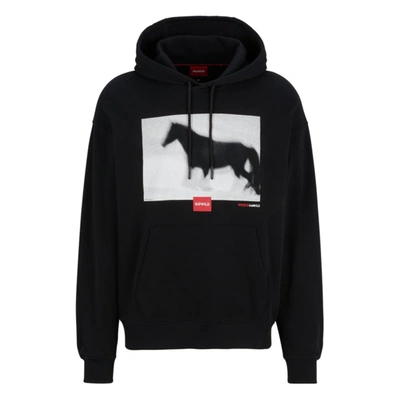Hugo Relaxed-fit Hoodie With Horse Graphic And Branding In Black
