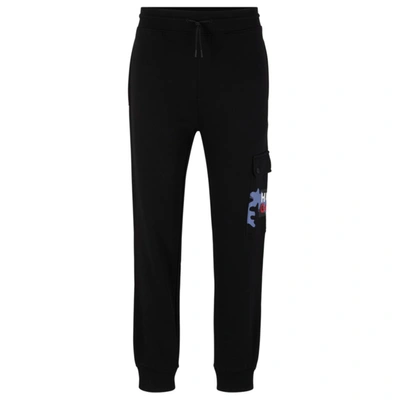 Hugo Boss Cotton-terry Tracksuit Bottoms With Camouflage Artwork In Black