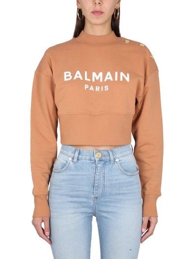 Balmain Cropped Buttoned  Logo Print Sweatshirt In Beige