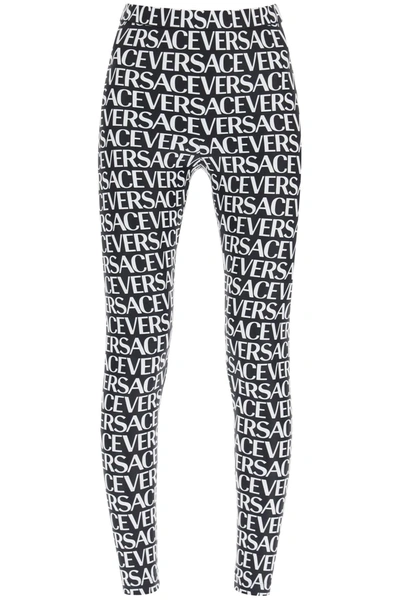 Versace All Over Logo Print Jersey Leggings In Black