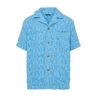 Versace Allover Logo-embossed Cotton Towel Shirt In Light Blue
