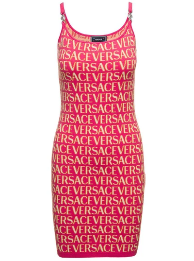 Versace Mini Fuchsia Dress With All-over Logo Lettering Print And Medusa Detail In Cotton Blend Woman In Fuxia