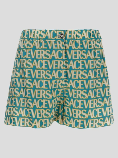Versace All-over Logo Shorts In Blue
