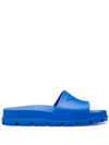 Prada Embossed-logo Open-toe Slides In Blue