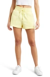 Nike Phoenix Fleece Knit Shorts In Lemon Chiffon/ Black