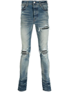 AMIRI DISTRESSED SKINNY JEANS