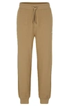 Hugo Boss Cotton-terry Tracksuit Bottoms With Logo Print In Brown