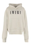 Amiri Logo-print Longline Hoodie In Beige
