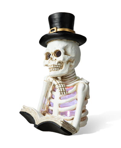 Glitzhome 10.25" H Halloween Lighted Resin Skull Reading Book Table Decor In Multi