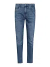 7 For All Mankind Faded Tapered Denim Jeans In Light Wash