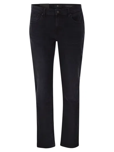 7 For All Mankind Slimmy Tapered Low Jeans In Denim In Black