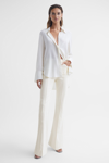 REISS FLORENCE - CREAM PETITE HIGH RISE FLARED TROUSERS, US 10
