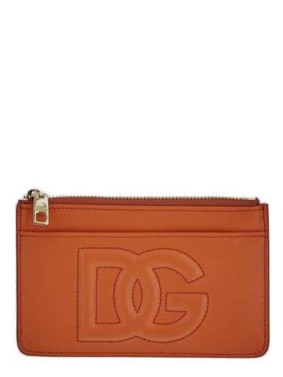 Dolce & Gabbana Logo Embossed Zipped Wallet In Orange