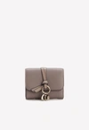 CHLOÉ ALPHABET TRI-FOLD COMPACT WALLET WITH GRAINED LEATHER