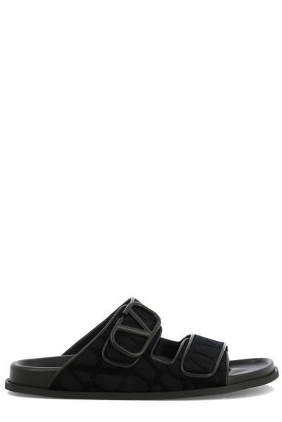 Valentino Garavani Logo-embellished Leather Slides In Black
