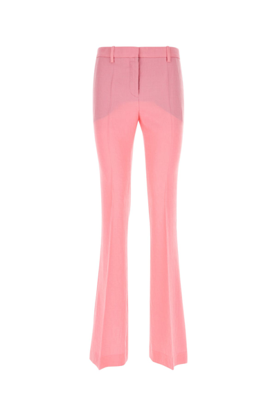 Versace Wool Flared Allover Logo Pants In Pink