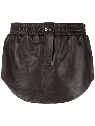 Attico Curved-hem Leather Miniskirt In Brown