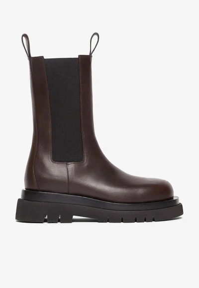 Bottega Veneta Lug Rubber-trimmed Leather Chelsea Boots In Nero