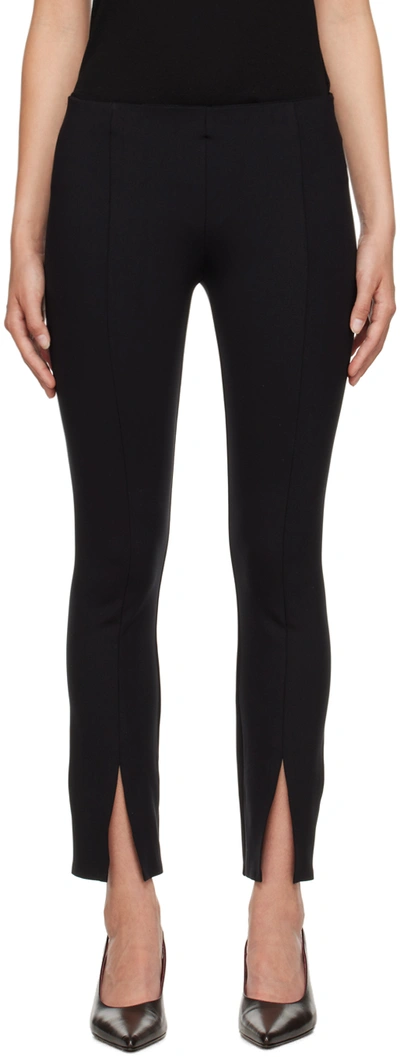 The Row Thilde Slit-cuff Pintucked Jersey Leggings In Black