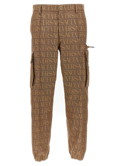 Versace Allover Logo-print Cargo Trousers In Brown