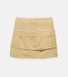 Jacquemus Caraco Buckled Layered Woven Mini Skirt In Beige